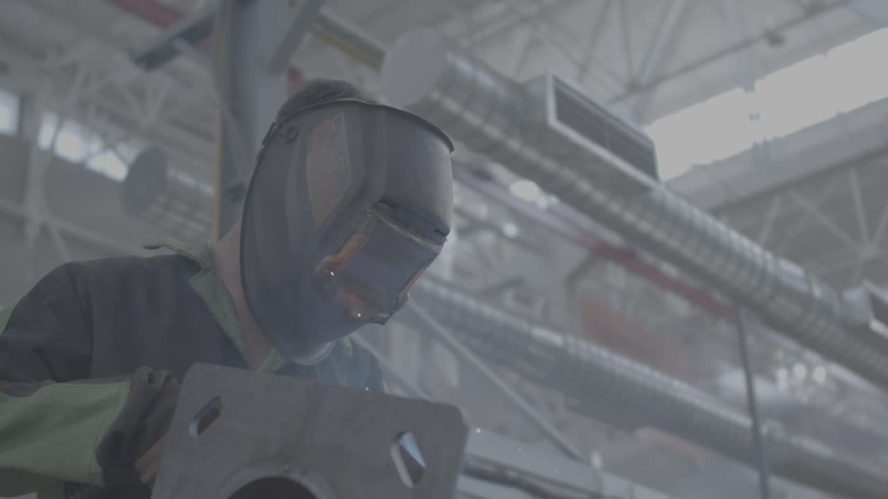 Welding in progress in an industrial workshop